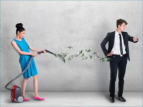 Woman vacuuming money out of a man's pocket