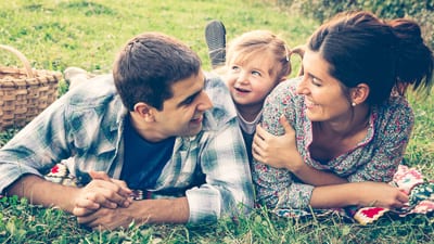 A family enjoying a picnic in a rural community.