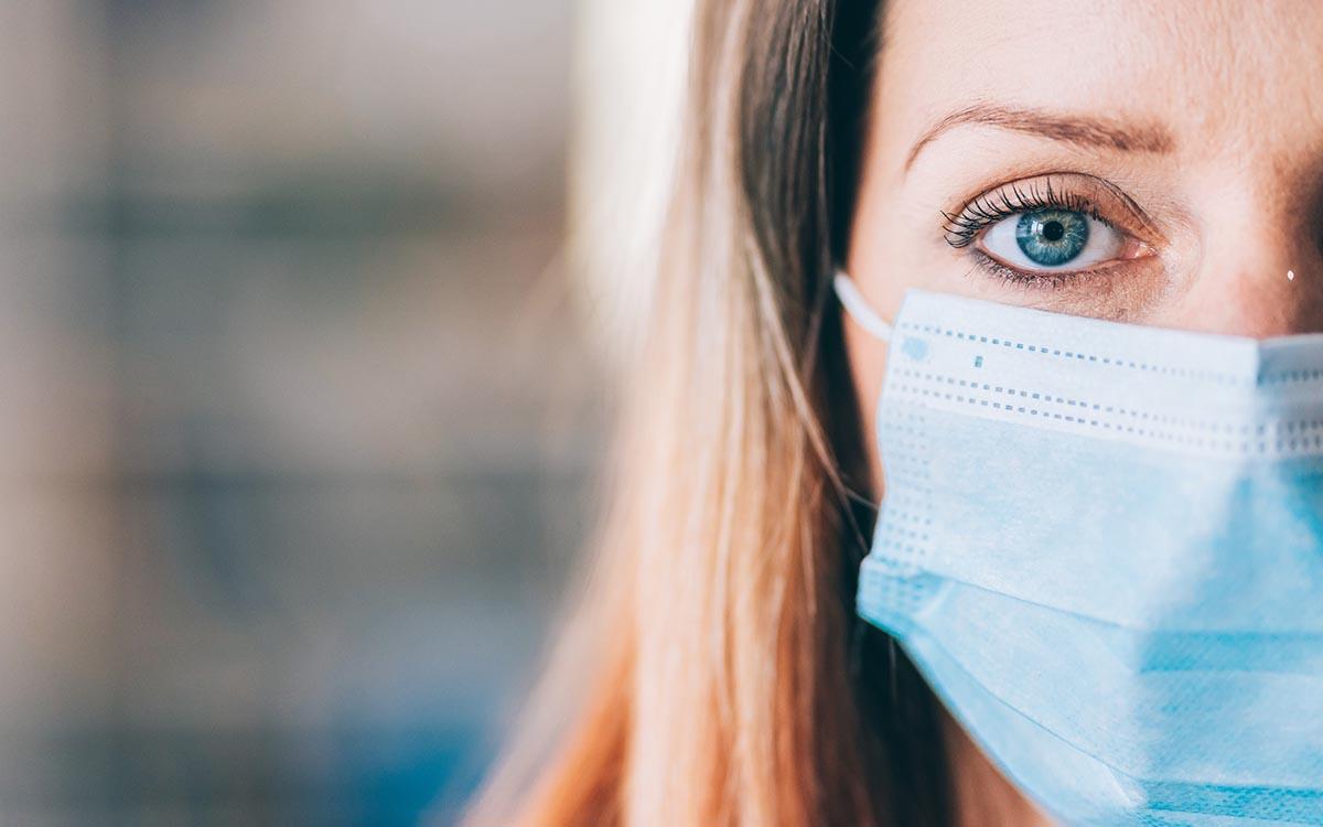 Woman wearing a face mask to protect herself from Covid-19