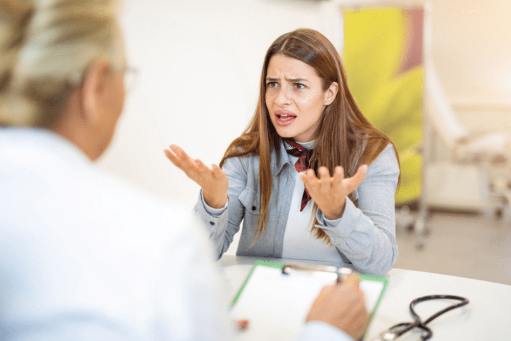 Angry patient talking to a doctor