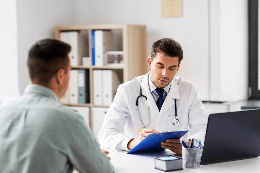 Urologist at a desk taking notes on market research