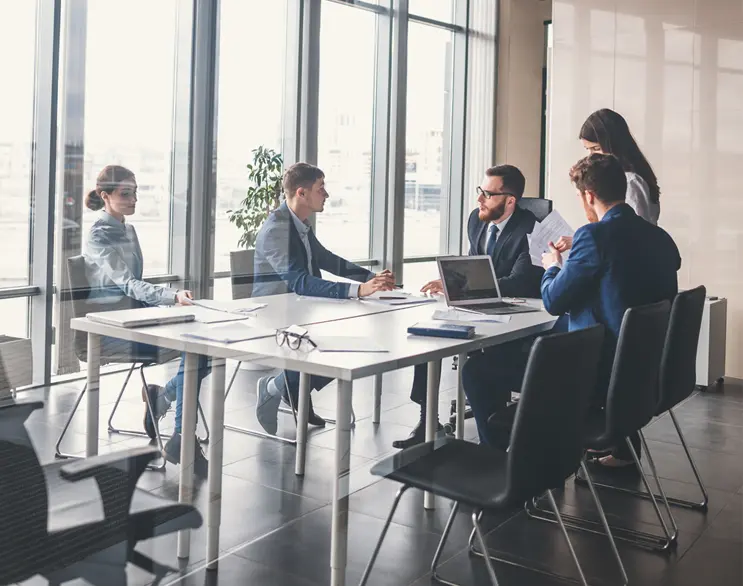 business people sitting around a conference table