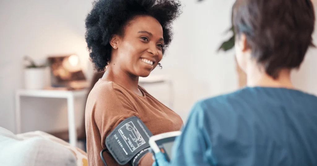 woman getting blood pressure checked.