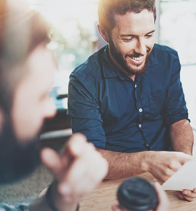 Happy Coworkers meeting.Blurred background.