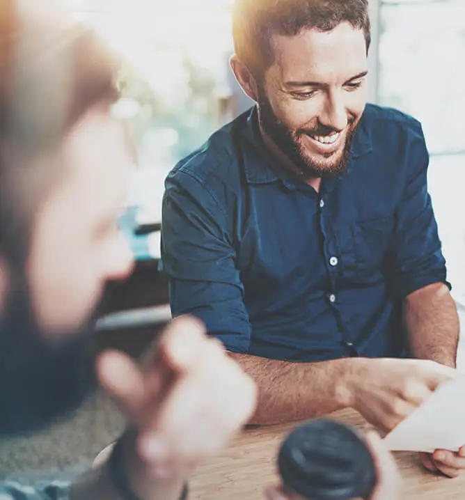 Happy Coworkers meeting.Blurred background.