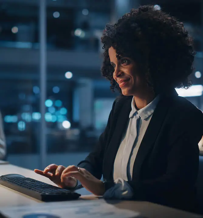 Portrait of African American Female Manager Using Computer