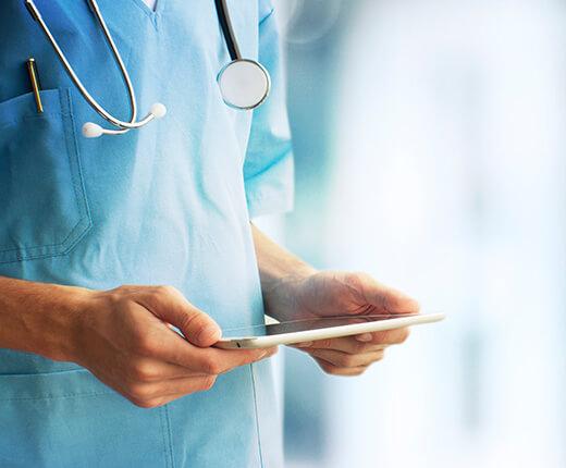 closeup of doctor looking at a tablet