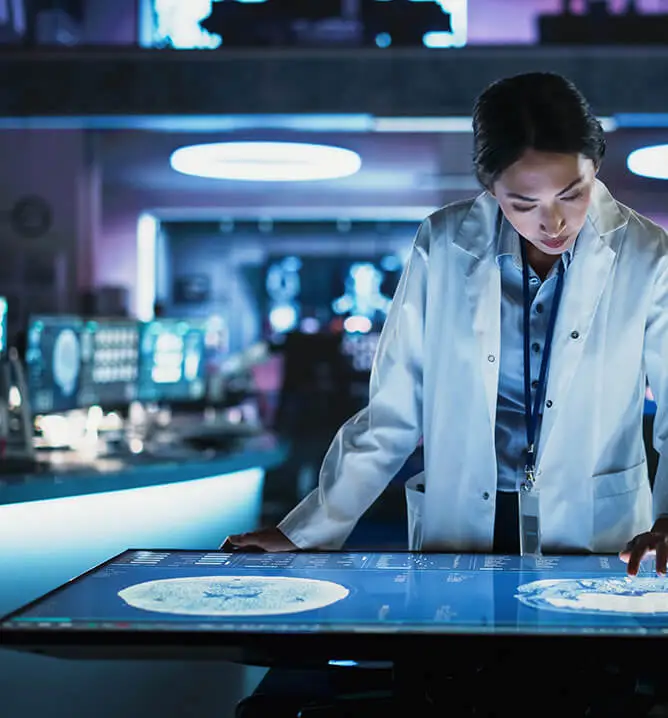 woman doctor working on computerized tabletop