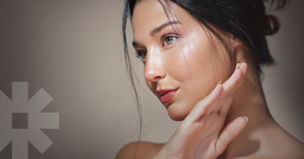 A woman looking away from the camera, representing how aesthetics and dermatology practices can set themselves apart in a saturated market.