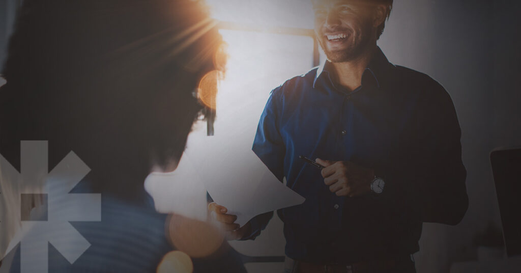 A sunlit photo of a healthcare marketing team collaborating among their specialized teams and team members.