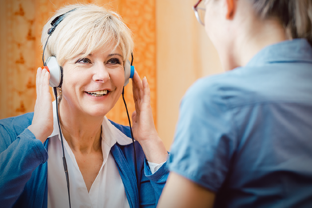 A woman takes a hearing test.