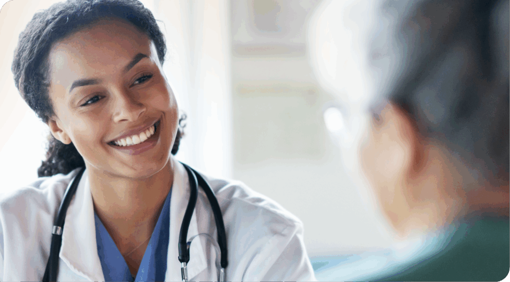 smiling female doctor talking to a patient