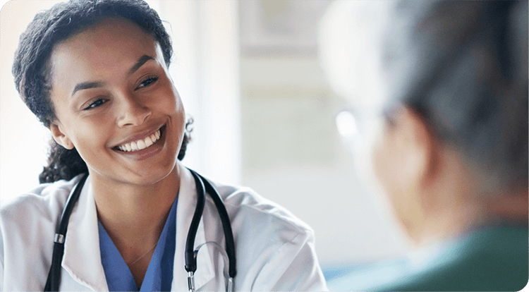 smiling female doctor talking to a patient