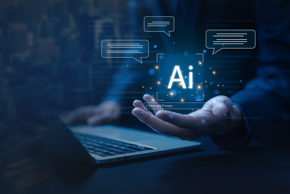 Human hand hovers over a laptop with “AI” animations.