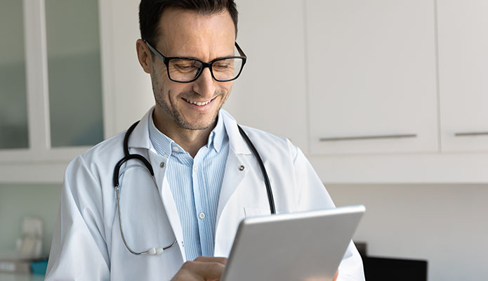 doctor looking at tablet