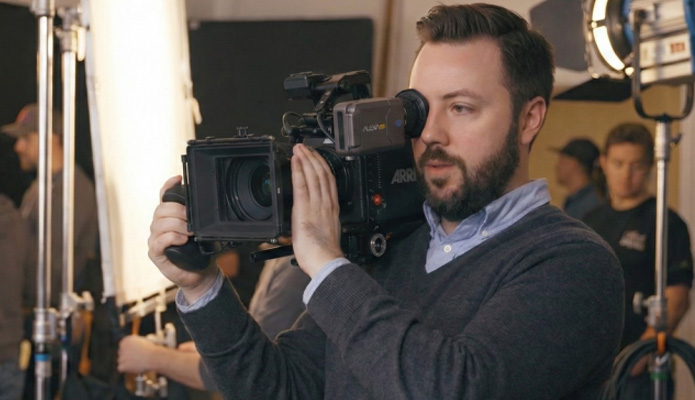 man using a video camera